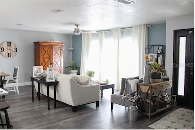 Three huge windows in great room.