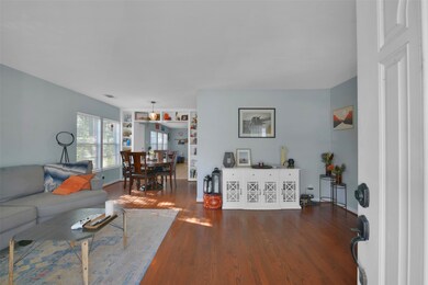 Upon entering, beautiful oak hardwood flooring greets you.