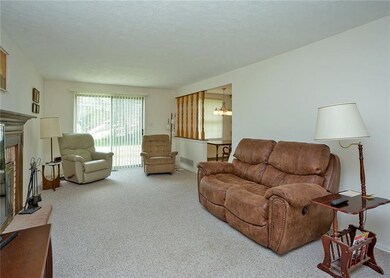 The glass sliding doors off the family room lead t