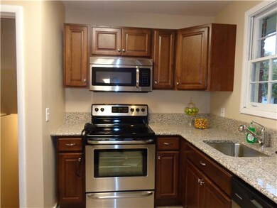 Along with those NEW cabinets are all new stainless steel  appliances. A new drop in sink and even new walls make this eat -in kitchen cozy. Great remodel for this home.