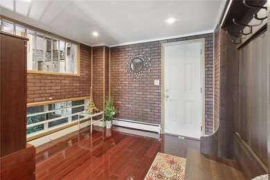 Mudroom/open study with the door leading to the ba