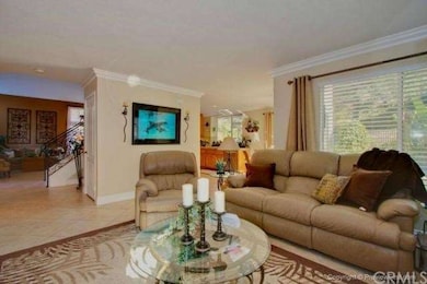 VIEW OF FAMILY ROOM, AND PORTIONS OF THE KITCHEN A