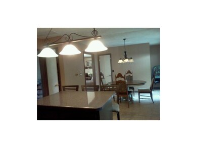 Kitchen island and beautiful light fixtures.