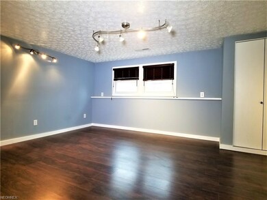 Large family room area is located right off the mu