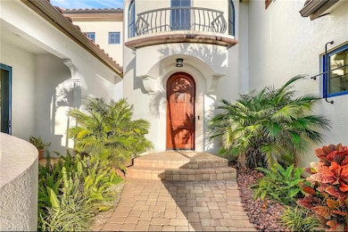 Property entrance featuring a balcony