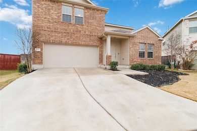 Traditional-style home with fence, an attached ga