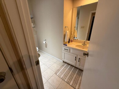 Bathroom with tile patterned flooring, vanity, an