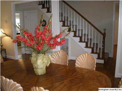 Spacious dining room  with tray ceilings.