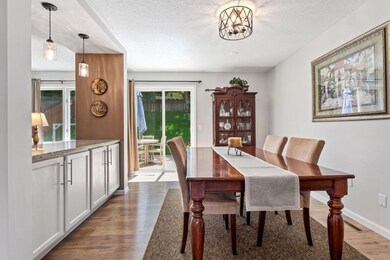 The dining room has added cabinetry with granite counter.
