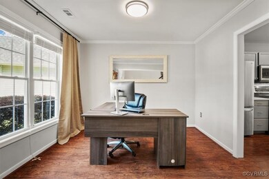 Home office featuring ornamental molding, a health
