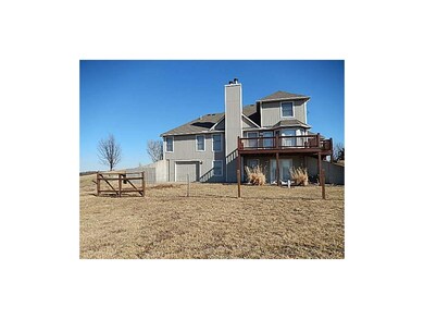 Back of the house. Note the 3rd car garage door an
