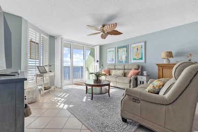 Living room featuring light tile patterned floors,