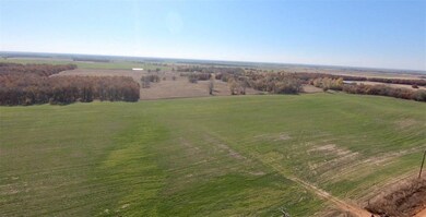 Birds eye view of property featuring a rural view