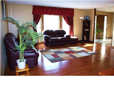 Formal Living room with big picture window and Har