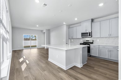 Kitchen featuring stainless steel appliances, an i