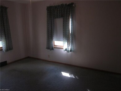 First floor bedroom, hardwood under carpet