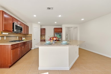Kitchen with large island & breakfast bar, great for entertaining and everyday living