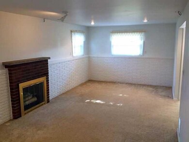 Family Room. Another view shows lots of sunlight e