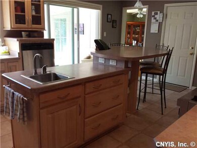 Kitchen Opens to 4 season sunroom and formal dinin