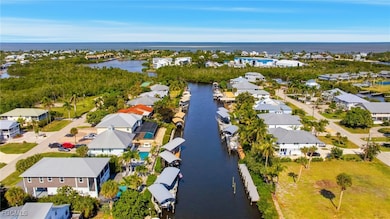 Aerial view of residential area featuring a large body of water
