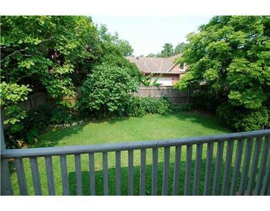 View. Second story balcony overlooks backyard