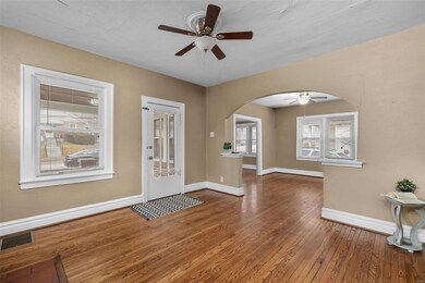 another view from the living room into the dining area and a peak into the sunroom