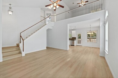 Unfurnished living room with ceiling fan, light w