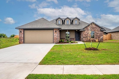 View of front of property featuring covered porch, concrete driveway, a garage, a shingled roof, and a front lawn