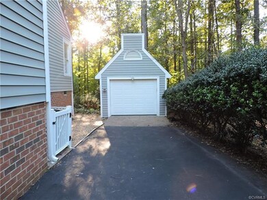One car detached garage includes shelves.