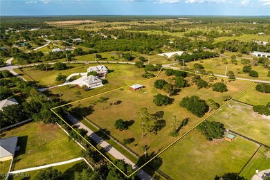 Birds eye view of property featuring a rural view