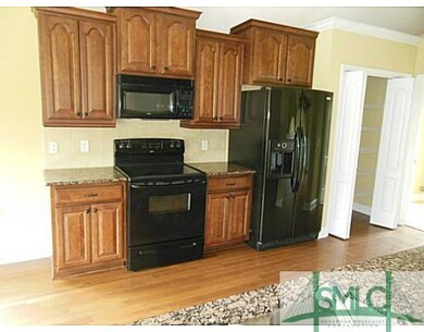 Kitchen. Staggered, upgraded style cabinets.