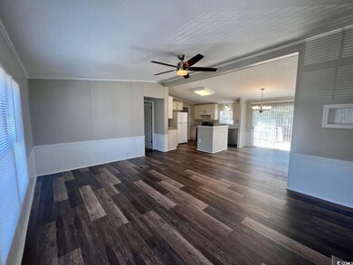 Unfurnished living room featuring hardwood / wood-