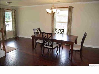 Dining Room with Hardwood Floors.