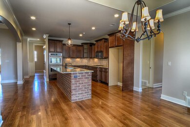 This expansive dream kitchen features a large bric