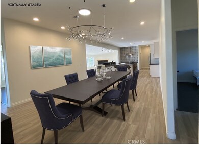 Virtually Staged Dining Room with chandelier added virtually