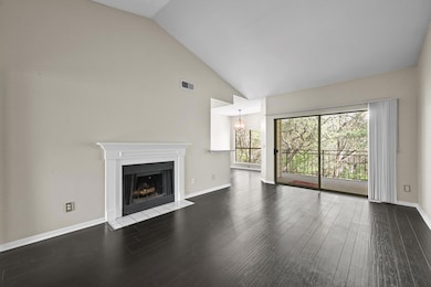 Unfurnished living room featuring a fireplace wit