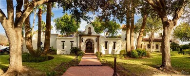 Mediterranean / spanish home with a front yard