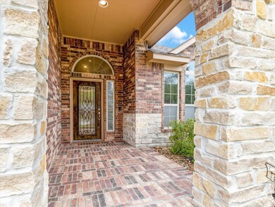 The covered front Porch is inviting with brick flo