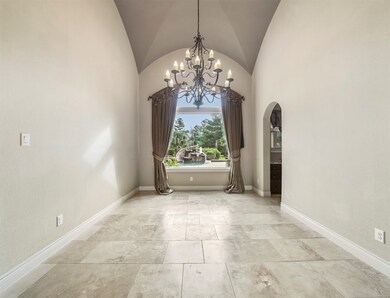 What an amazing view! This formal dining area is prefect for entertaining, you will love the easy flow from the kitchen.