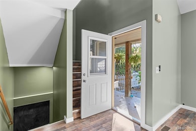 Entryway featuring dark wood-style flooring