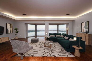 Living area featuring a water view, visible vents,