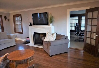 Fireplace with room for the big screen! French doo