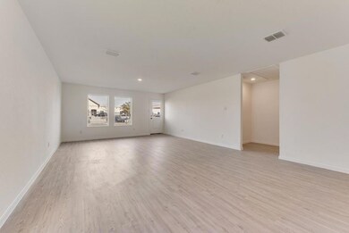 Spare room featuring light wood-type flooring