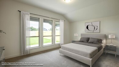 Carpeted bedroom with lofted ceiling and baseboar