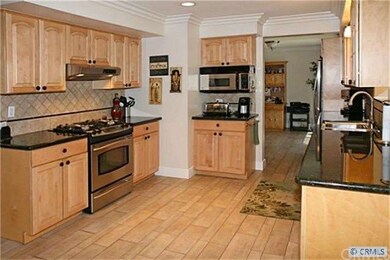 Kitchen also has stainless appliances including ga