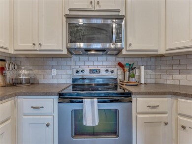 Kitchen:  Stainless appliances, granite-style coun