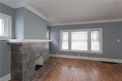 Lg Decorative FP w/ Tiled Front, Stone Hearth & Wood Mantel. Thick Crown Molding & Freshly Painted Walls.