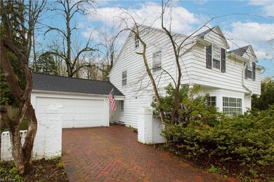 Lovely curb appeal and custom brick paver driveway