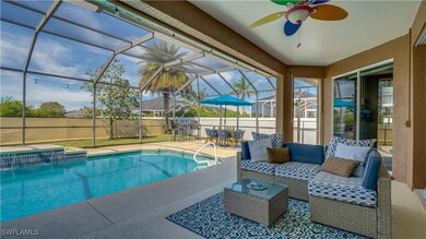 View of pool with a lanai, outdoor living space, a