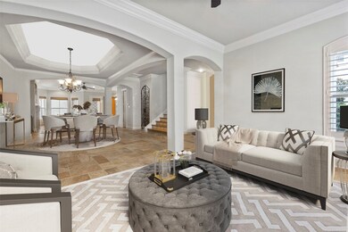 Formal living room with arched trim and designer touches.